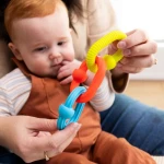 Fat Brain Toys zabawka sensoryczna do rozwoju małej motoryki Plip Grips